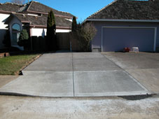 Expand existing driveway and install wood trash enclosure and bike stand